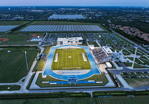 aerial view of IMG academy's football stadium at night