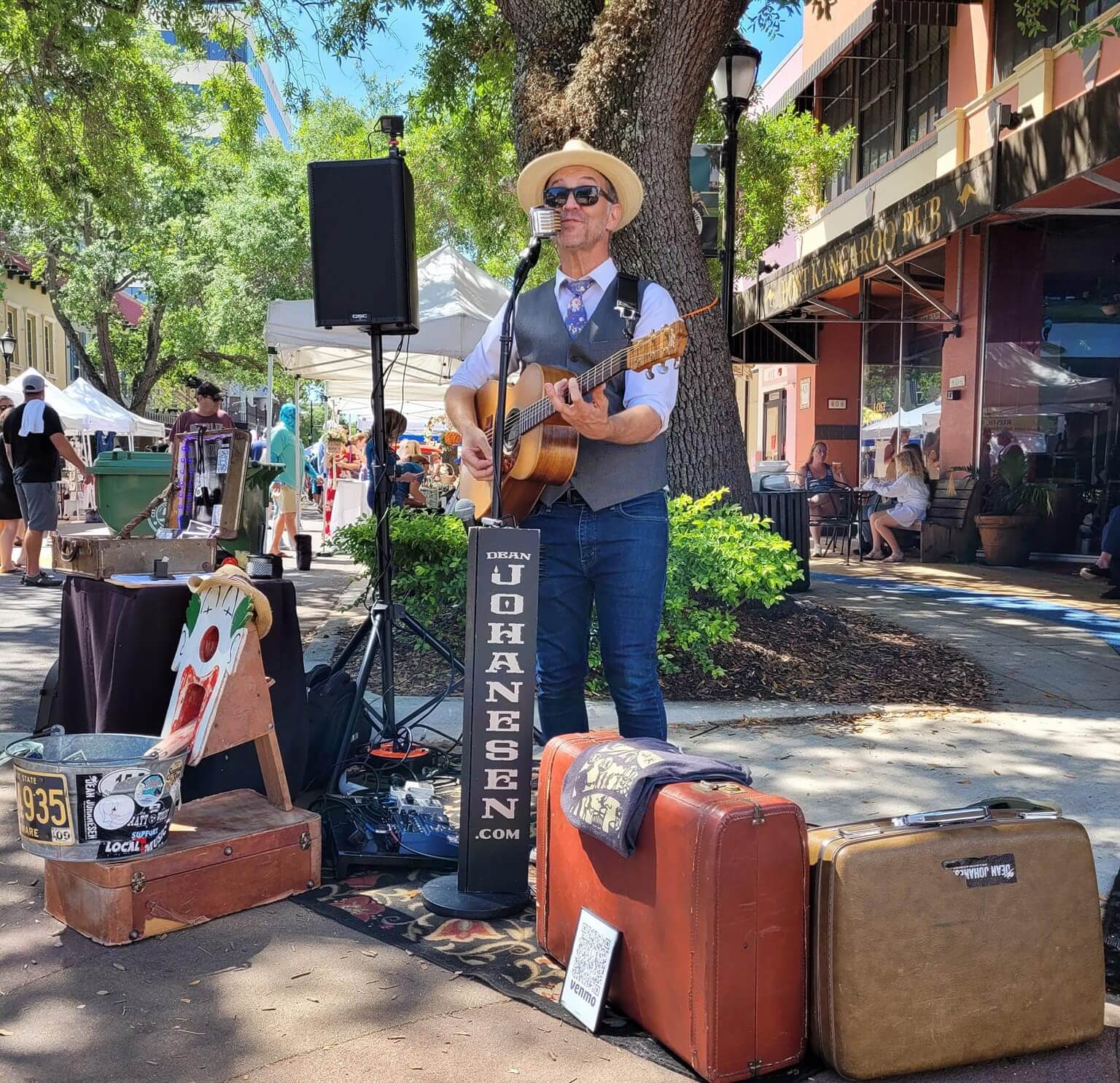 man playing live music at the bradenton public market
