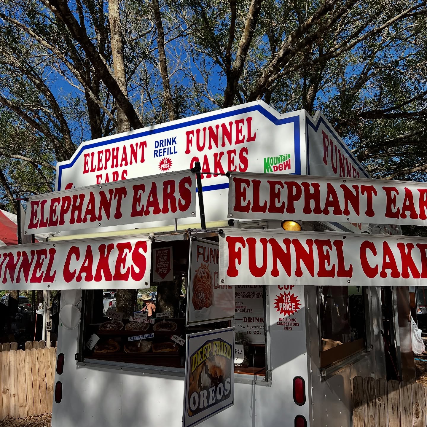 Food stand selling elephant ears, funnel cakes