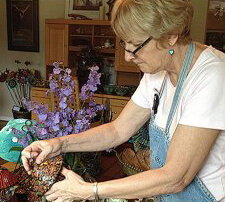 Picture of artist Susan Swanson working in studio