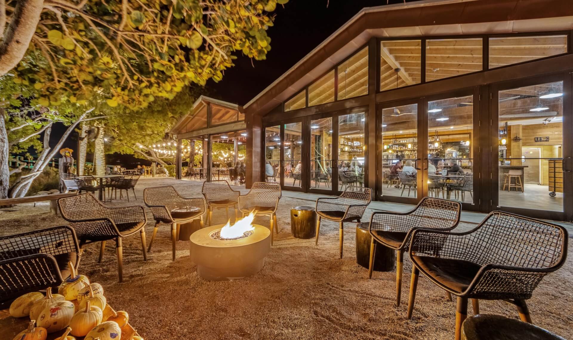 Dreamy Spots to Dine Under the Stars mar vista dockside at night with a large firepit