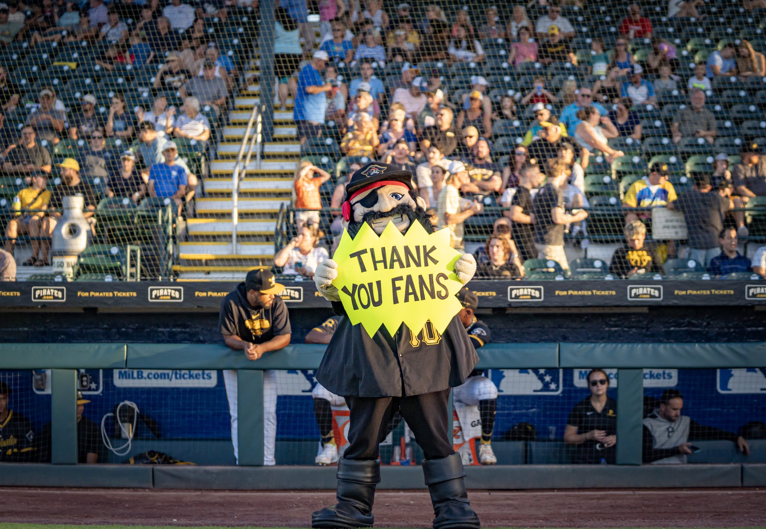 Marty on the field, in black #10 jersey, holding a yellow-green 