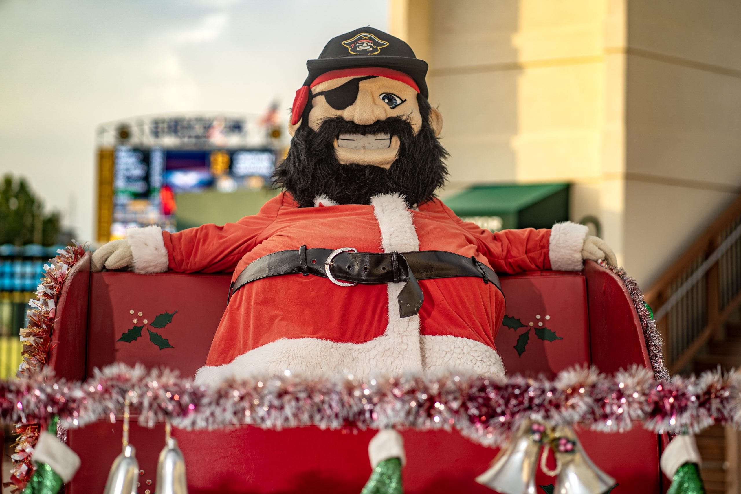 Marty siting in a sleigh dressed as Santa