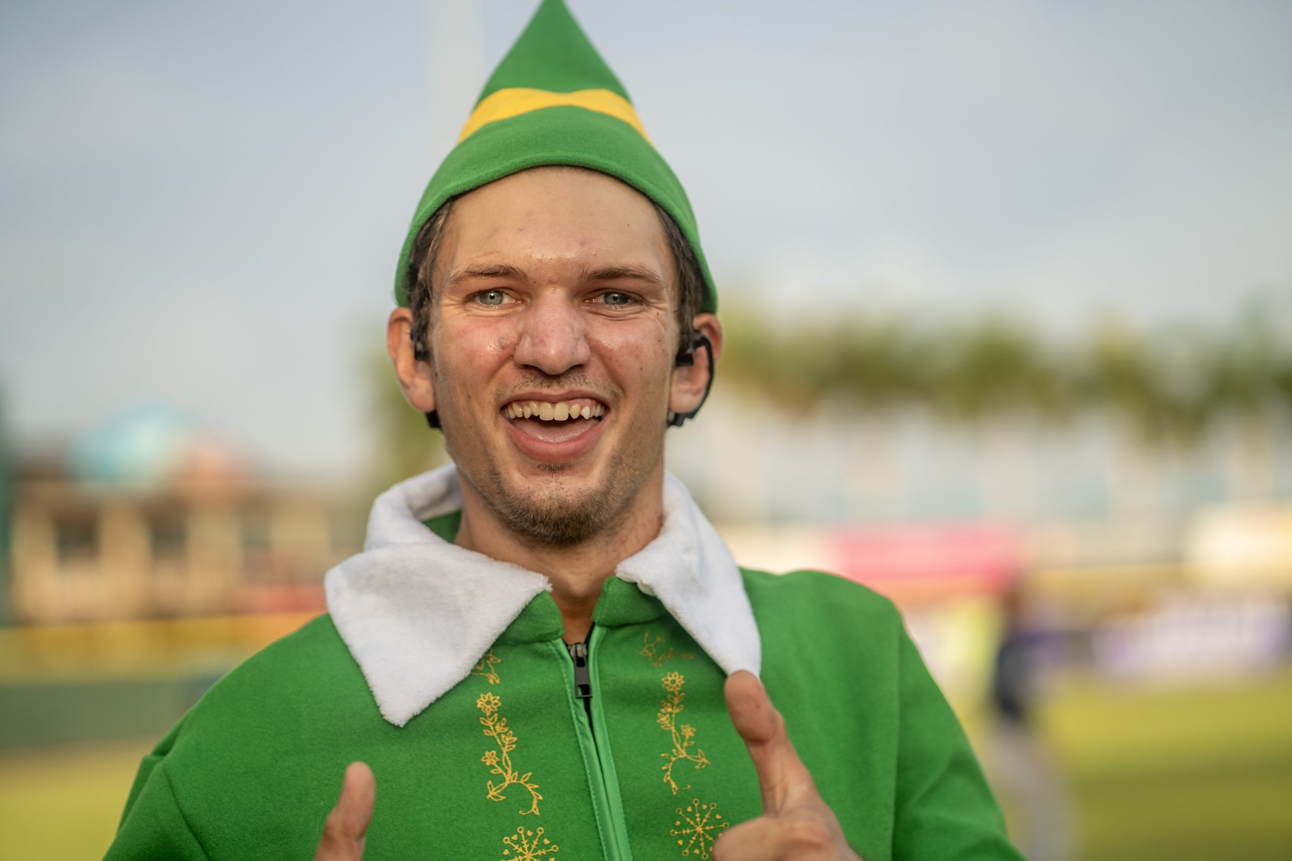 Male with two thumbs up, dressed as an elf