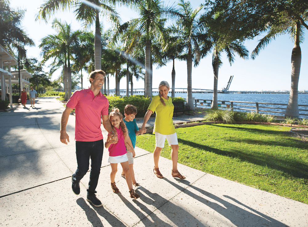 Everyday Escape Pass family on the Bradenton Riverwalk on a sunny day